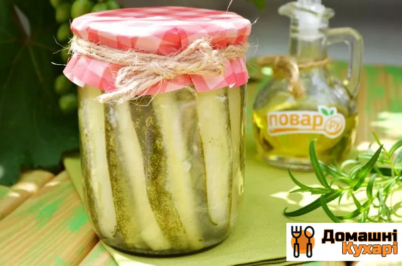 Огірки, консервовані часточками